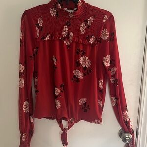 Red flowered long sleeve mock neck top.